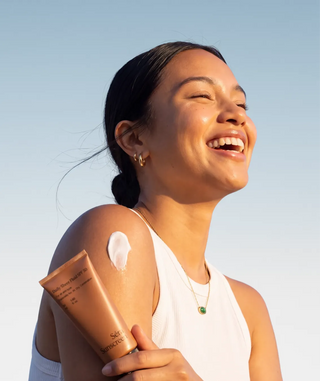 Model using Daily Sheer Fluid SPF 50