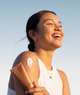 Model using Daily Sheer Fluid SPF 50