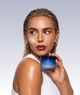 Model using Night Recovery Cream