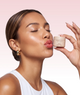 Model using Overnight Lip Balm