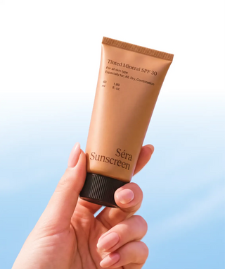 Hand holding Tinted Mineral SPF 30